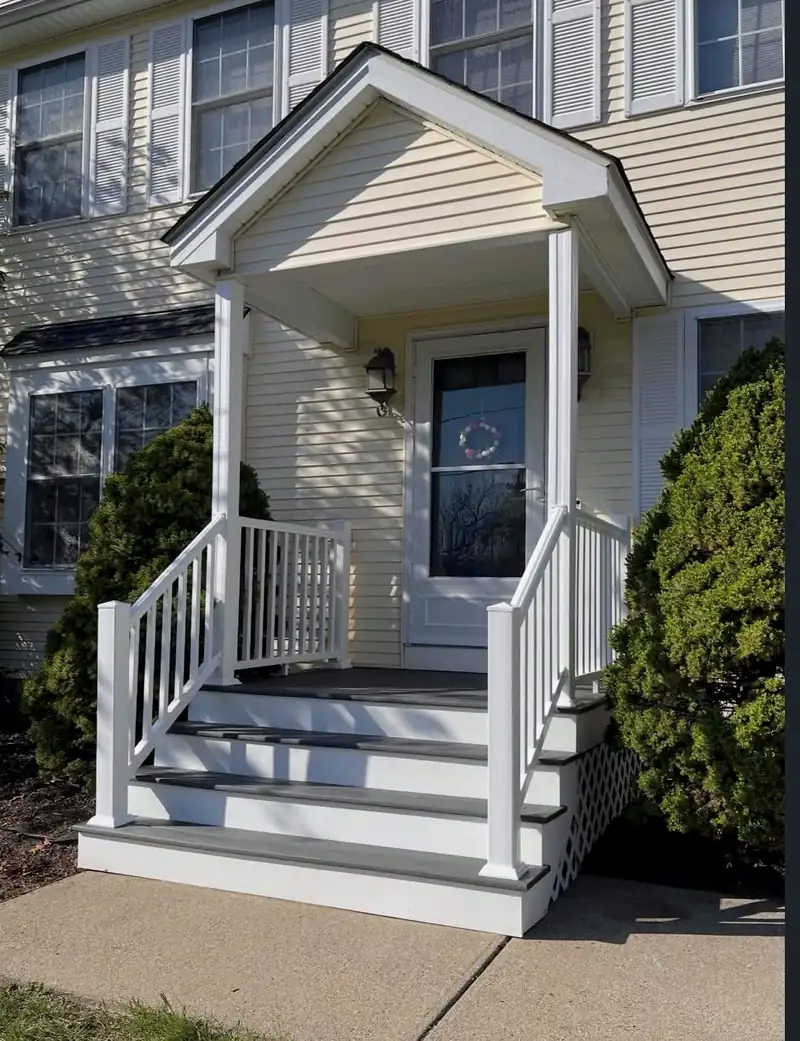 Front portico with new steps and white railings